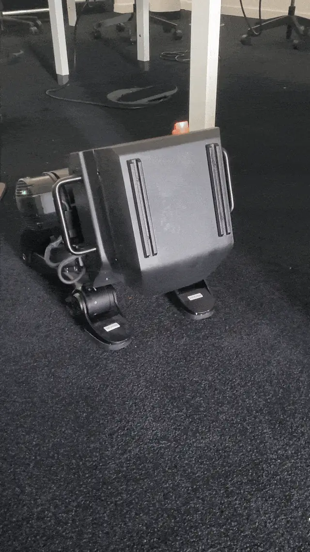 Indoor test of the locomotion controller on a compact bipedal robot testbed platform (not the full-scale Forrest hardware)